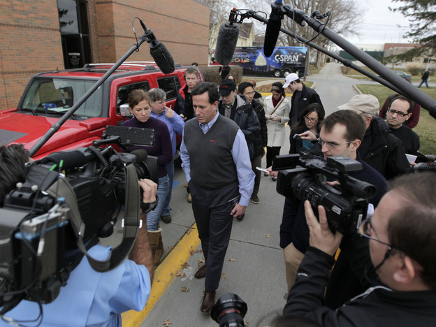 Rick Santorum with news media after a campaign stop in Indianola, Iowa.