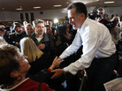 Former Massachusetts Gov. Mitt Romney greets voters after speaking at the Mississippi Valley Fairgrounds on Wednesday in Davenport, Iowa. Former Massachusetts Gov. Mitt Romney greets voters after speaking at the Mississippi Valley Fairgrounds on Wednesday in Davenport, Iowa.