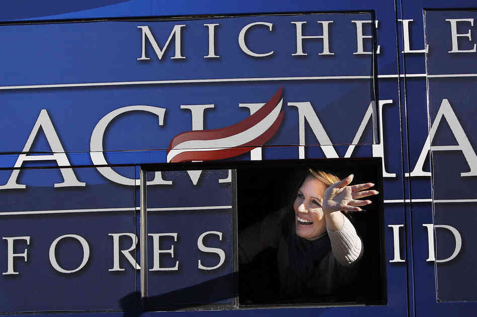 Rep. Michele Bachmann of Minnesota waves from her bus following a campaign stop Monday in West Des Moines, Iowa. 