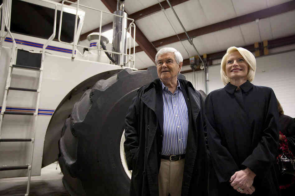 Newt Gingrich and his wife Callista take a tour of the Heartland Acres Agribition Center during a campaign stop Monday in Independence, Iowa.  