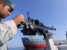 An Iranian Army soldier stood guard on a military speed boat during navy exercises in the Strait of Hormuz in southern Iran late last week. An Iranian Army soldier stood guard on a military speed boat during navy exercises in the Strait of Hormuz in southern Iran late last week.