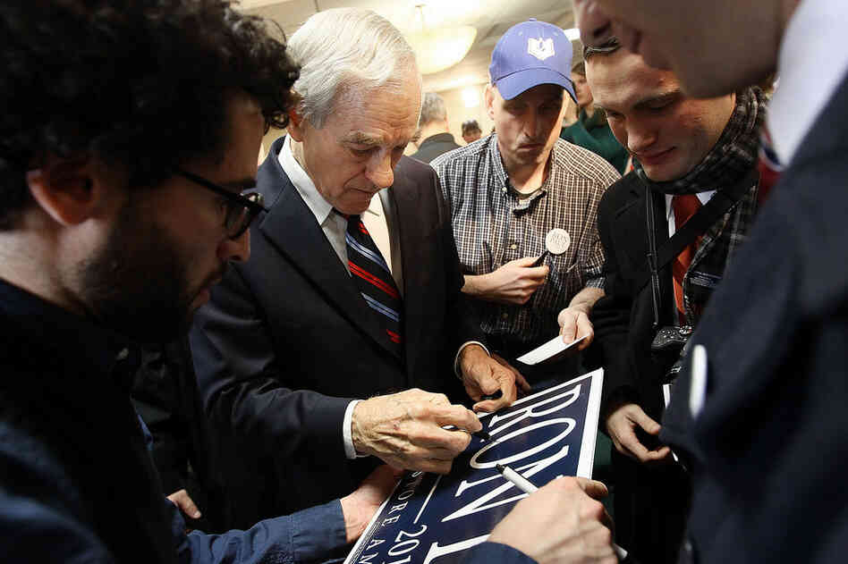 U.S. Rep. Ron Paul of Texas signs autographs for supporters after a campaign event during his "Whistle-stop" tour at the Steeple Gate inn Monday in Davenport, Iowa. 