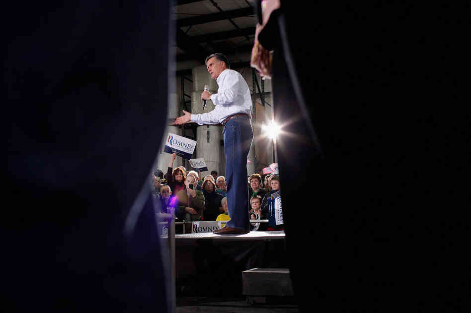 Former Massachusetts Gov. Mitt Romney addresses supporters during a campaign rally at the Weber Paper Company Monday in Dubuque, Iowa.  