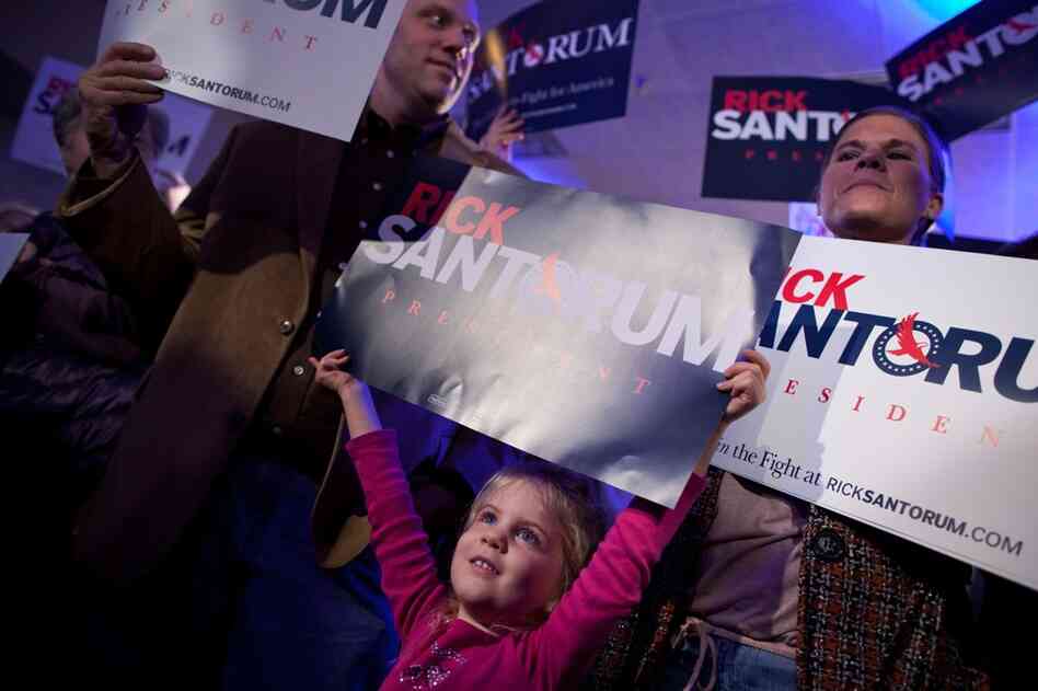 Zoey McCarty (center) and Santorum supporters wait for caucus results in Johnston. 
