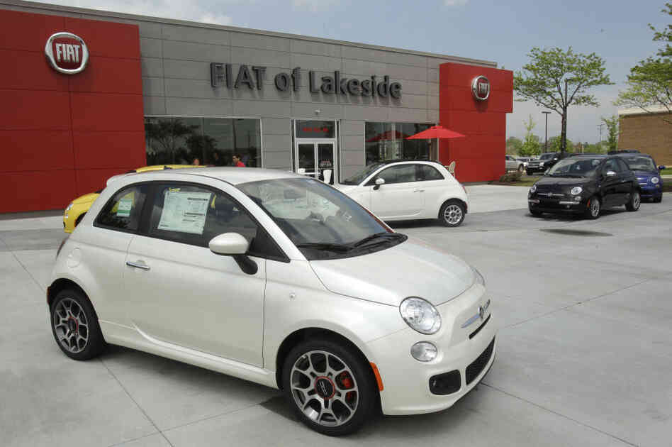 In its 2011 re-entry into the U.S. market, Italian automaker Fiat opened 130 dealerships — or studios, as the company calls them — that sold only the Fiat 500, displayed here outside the Fiat of Lakeside dealership in Macomb, Mich. In its 2011 re-entry into the U.S. market, Italian automaker Fiat opened 130 dealerships — or studios, as the company calls them — that sold only the Fiat 500, displayed here outside the Fiat of Lakeside dealership in Macomb, Mich.