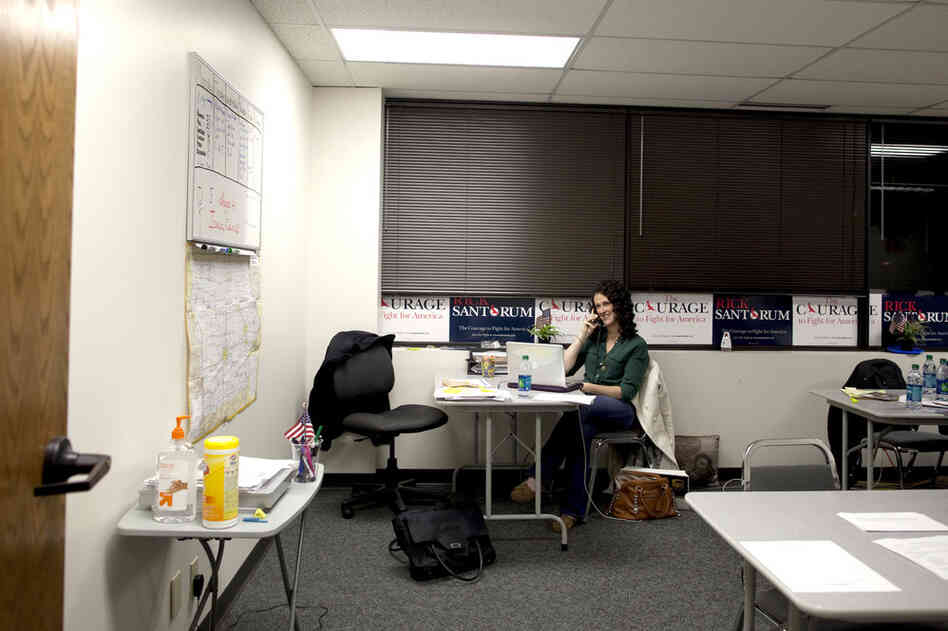 Santorum's daughter Elizabeth makes calls at his campaign headquarters, which was buzzing with activity when we arrived in the early evening.