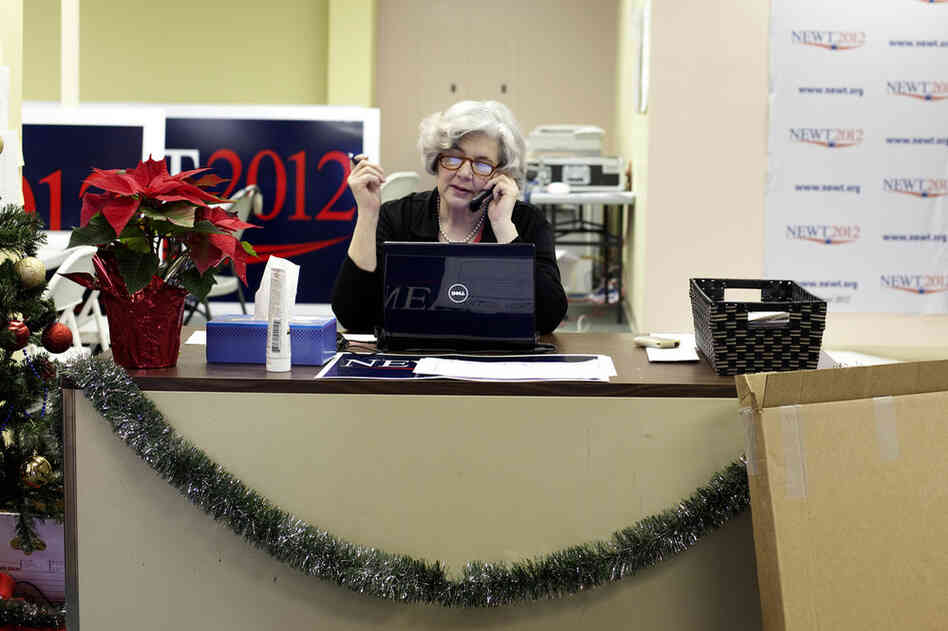 Volunteer Judy Reynolds answers calls at Gingrich's headquarters. Reynolds was one of a handful of volunteers there when we stopped by — around the same time as Gingrich's first event in Des Moines.