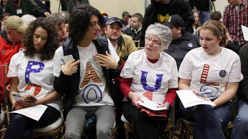 Supporters of Republican presidential hopeful Ron Paul rally for their candidate during a campaign stop Monday in Cedar Falls, Iowa. Supporters of Republican presidential hopeful Ron Paul rally for their candidate during a campaign stop Monday in Cedar Falls, Iowa.