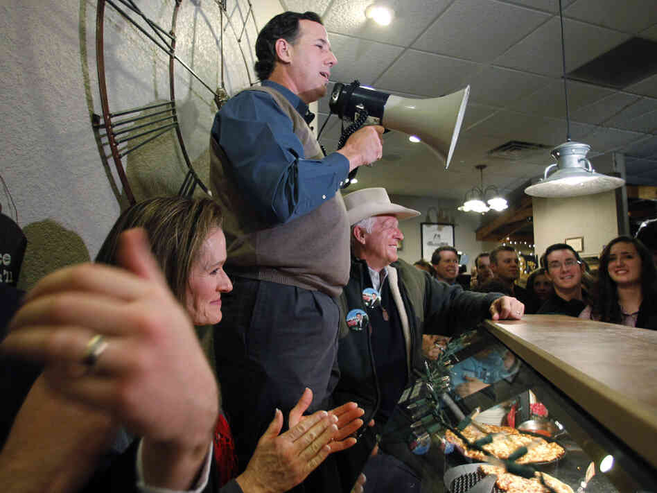 Former Pennsylvania Sen. Rick Santorum, who has recently surged in the Iowa polls, addresses Iowans during a meet-and-greet campaign stop Monday at the Pizza Ranch in Altoona.