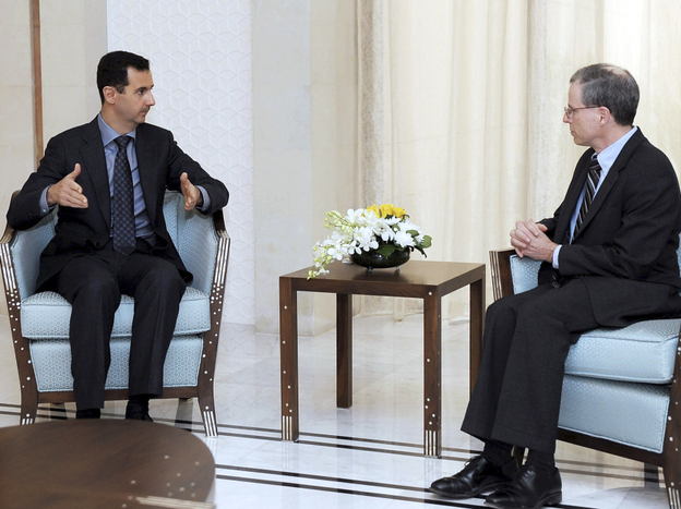 Syrian President Bashar Assad, shown meeting with U.S. Ambassador Robert Ford last January, blames the uprising in Syria on Islamic radicals. 
