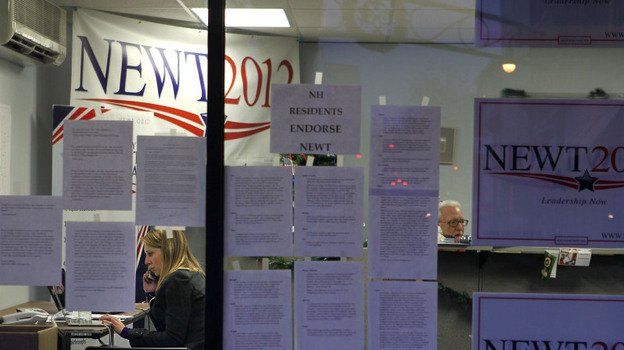 A volunteer works the phones Tuesday at Newt Gingrich's New Hampshire campaign headquarters in Manchester.