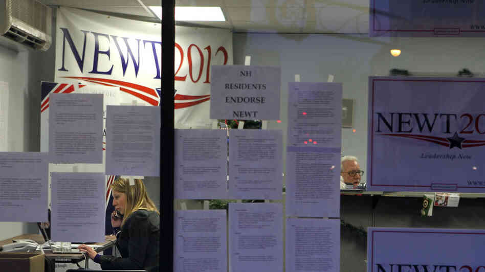 A volunteer works the phones Tuesday at Newt Gingrich's New Hampshire campaign headquarters in Manchester.