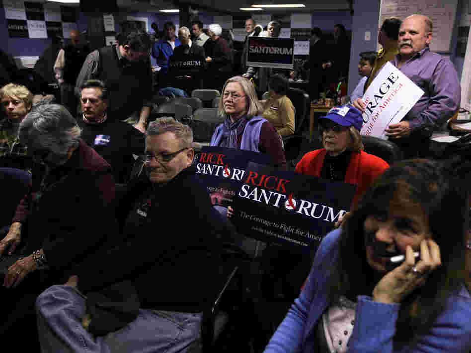 Santorum supporters watch the vote count during an Iowa caucus watch party in New Hampshire on Tuesday night. 