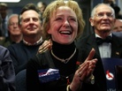 Susan Carroll of Atkinson, N.H., reacts to news of a Santorum lead at a caucus-watching party at Santorum's New Hampshire campaign headquarters in Bedford. Carroll is the Santorum campaign's Tea Party liaison for the state and describes herself as the owner of a small business that offers "artistic services." Susan Carroll of Atkinson, N.H., reacts to news of a Santorum lead at a caucus-watching party at Santorum's New Hampshire campaign headquarters in Bedford. Carroll is the Santorum campaign's Tea Party liaison for the state and describes herself as the owner of a small business that offers "artistic services."