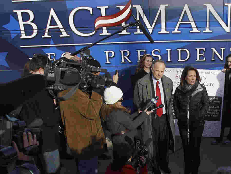 Republican presidential candidate Michele Bachmann (center) talks to the media after a campaign stop Tuesday at Valley High School in West Des Moines, Iowa. Republican presidential candidate Michele Bachmann (center) talks to the media after a campaign stop Tuesday at Valley High School in West Des Moines, Iowa.