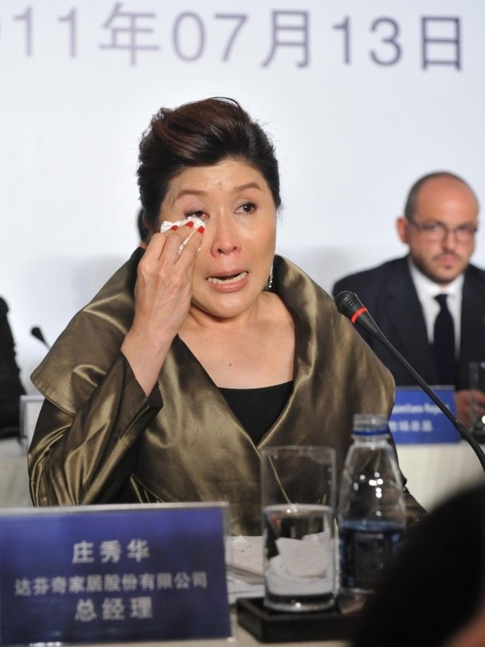 Doris Phua, chief executive of Da Vinci, answers questions during a press conference in Beijing in July, after CCTV accused it of selling fake furniture at high prices. Later, the company said it paid the CCTV reporter more than $150,000 through a public relations company to halt further stories.