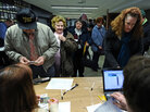 Voters register to cast their ballots during republican caucues at a school in Des Moines, Iowa, on January 3, 2012. Voters register to cast their ballots during republican caucues at a school in Des Moines, Iowa, on January 3, 2012.