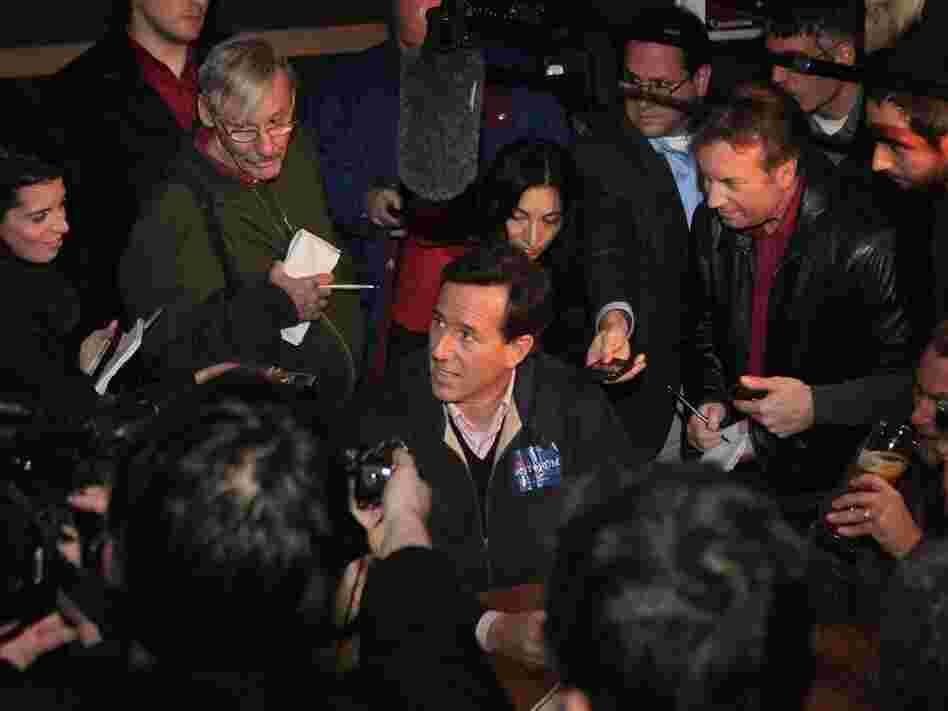 Republican presidential candidate and former U.S. Senator Rick Santorum is mobbed by press on Dec. 30 in Ames, Iowa. 