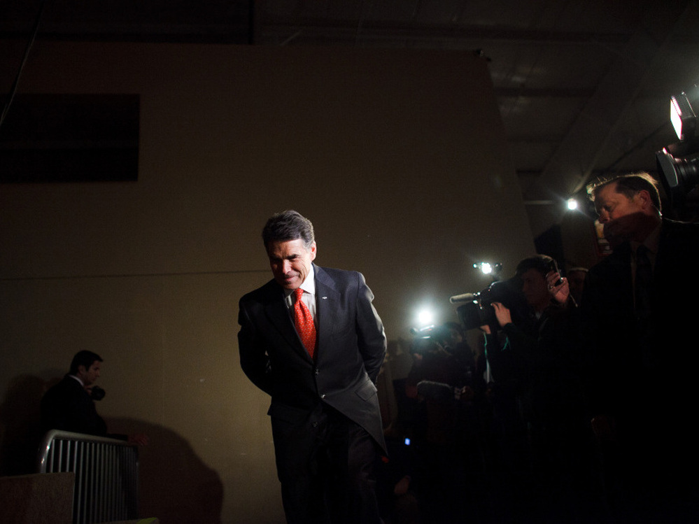 Perry prepares to speak with voters attending the West Des Moines caucus in Iowa on Jan. 3.