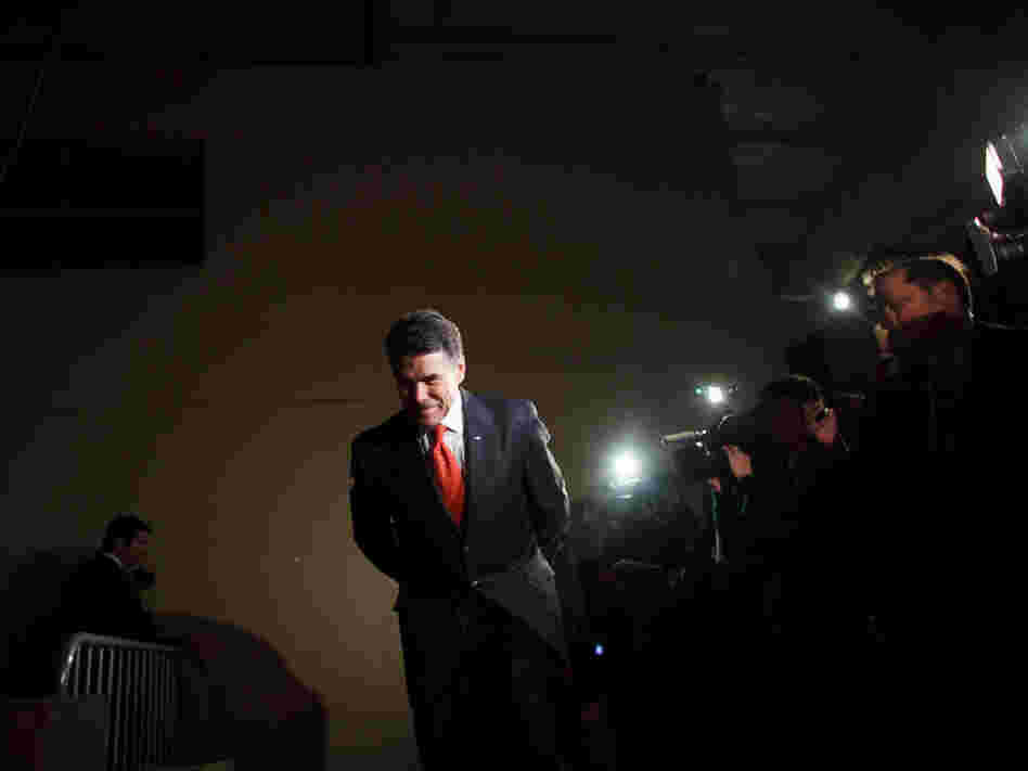 Perry prepares to speak with voters attending the West Des Moines caucus in Iowa on Jan. 3.