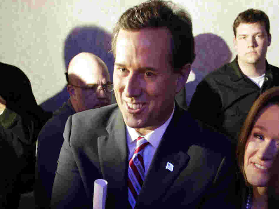 Former Pennsylvania Sen. Rick Santorum greets supporters after his caucus night rally in Johnston, Iowa, on Tuesday.