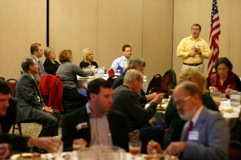 A surrogate makes the case for a GOP presidential candidate at a First Tuesday Republican Club lunch in Columbia, S.C., on Jan. 3.