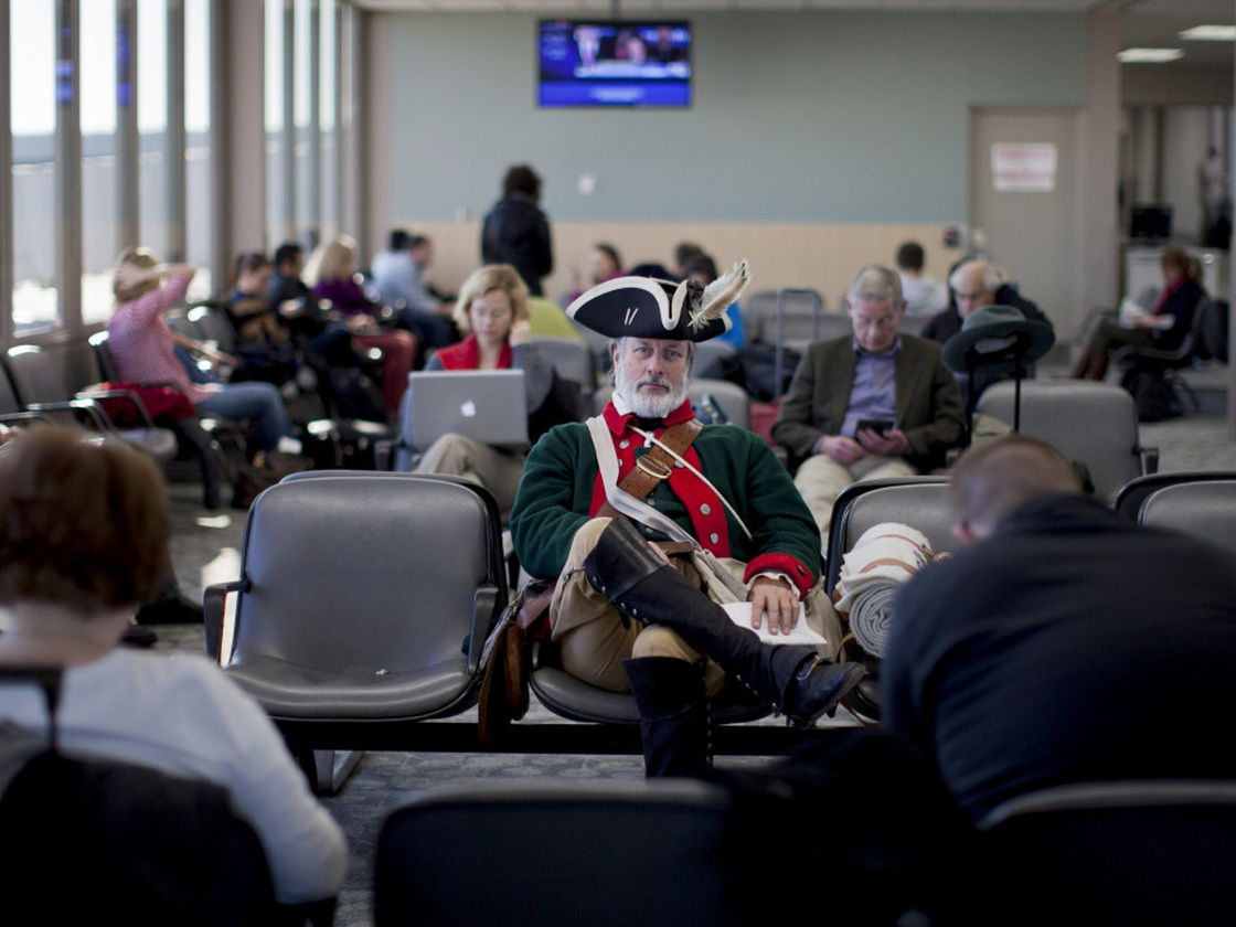 Tea Partier William Temple of Brunswick, Ga., waits for a flight at Des Moines International Airport on Wednesday, a day after the Iowa caucuses.