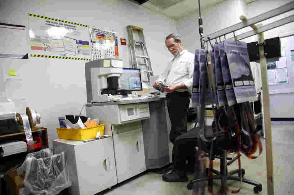 Bill Jonscher works behind the scenes at Penn Camera, processing film and making prints.