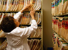 Clinic office assistant Joan Vest searches for a patient's missing medical file at the Spanish Peaks Family Clinic on August 5, 2009 in Walsenburg, Colorado. Clinic office assistant Joan Vest searches for a patient's missing medical file at the Spanish Peaks Family Clinic on August 5, 2009 in Walsenburg, Colorado.