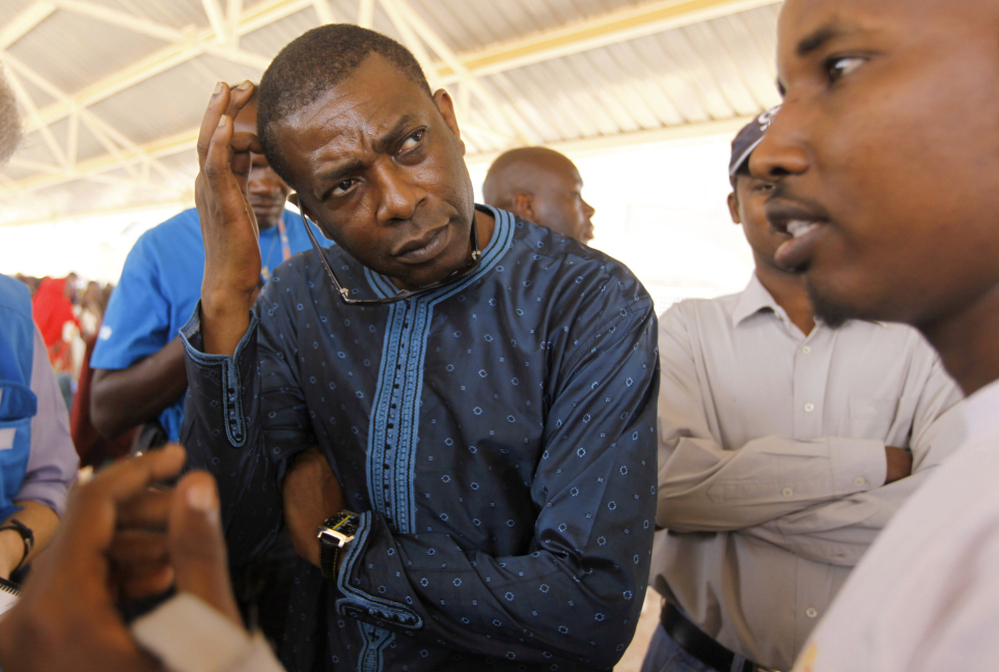 N'Dour, who was serving as a UNICEF Goodwill Ambassador at the time, visits a food distribution center at the Dadaab refugee camp in Kenya last fall. 