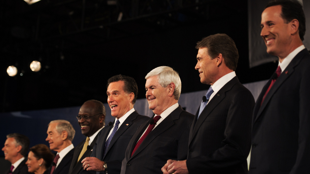Rick Santorum (right) was put on one end of the candidates, Jon Huntsman (far left) on the other during a Nov. 12 televised debate in South Carolina. During the debate, Huntsman complained about being "a little lonely over here in Siberia," and Santorum responded: "Tell me about it."