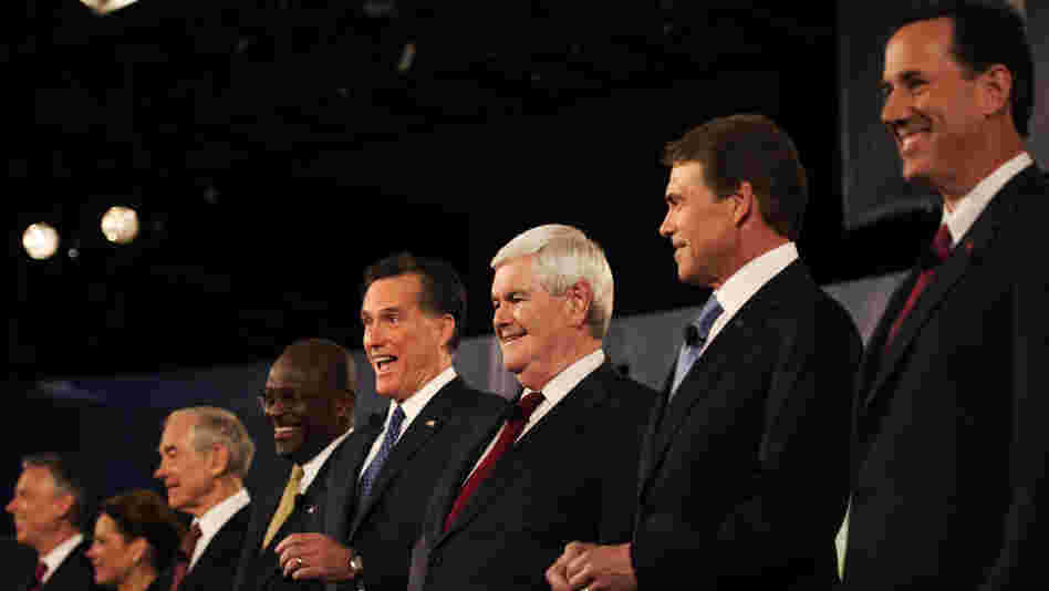 Rick Santorum (right) was put on one end of the candidates, Jon Huntsman (far left) on the other during a Nov. 12 televised debate in South Carolina. During the debate, Huntsman complained about being "a little lonely over here in Siberia," and Santorum responded: "Tell me about it."