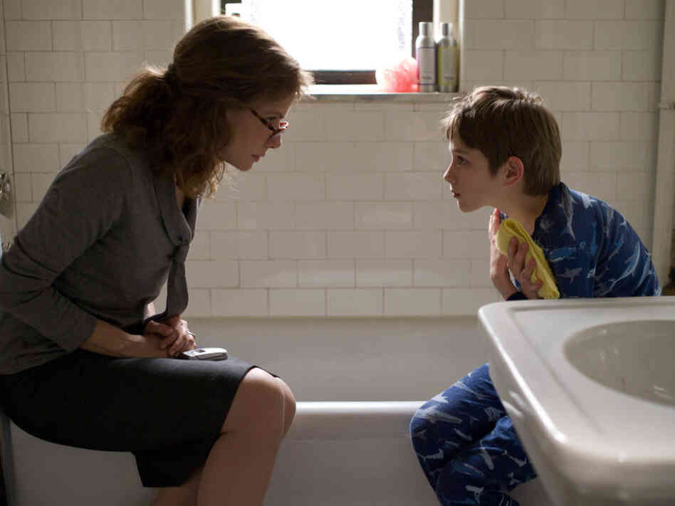 Oskar lies to his mother, played by Sandra Bullock, about a series of phone messages left by his father on the morning of Sept. 11, 2011.