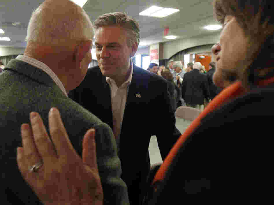Former Utah Gov. Jon Huntsman shakes hands with voters following a business lunch campaign event in Portsmouth, N.H. on Jan. 5. 