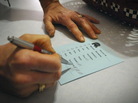 Barb Hansen tallies votes during a GOP caucus in precinct 42 near Smithland, Iowa, on Tuesday, Jan. 3, 2012. Barb Hansen tallies votes during a GOP caucus in precinct 42 near Smithland, Iowa, on Tuesday, Jan. 3, 2012.