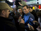 Former Pennsylvania Sen. Rick Santorum talks with a customer while surrounded by news crews as he pays a visit to customers at the Tilt 'n Diner in Tilton, NH, on Jan. 5. Former Pennsylvania Sen. Rick Santorum talks with a customer while surrounded by news crews as he pays a visit to customers at the Tilt 'n Diner in Tilton, NH, on Jan. 5.