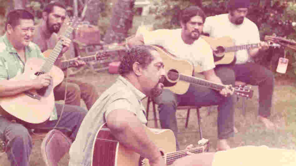 Gabby Pahinui (center), playing in his family's backyard with (from left to right) Leland "Atta" Isaacs, Philip Pahinui, Cyril Pahinui and Martin Pahinui. This photo is in the album insert for the 1972's Gabby. Gabby Pahinui (center), playing in his family's backyard with (from left to right) Leland "Atta" Isaacs, Philip Pahinui, Cyril Pahinui and Martin Pahinui. This photo is in the album insert for the 1972's Gabby.