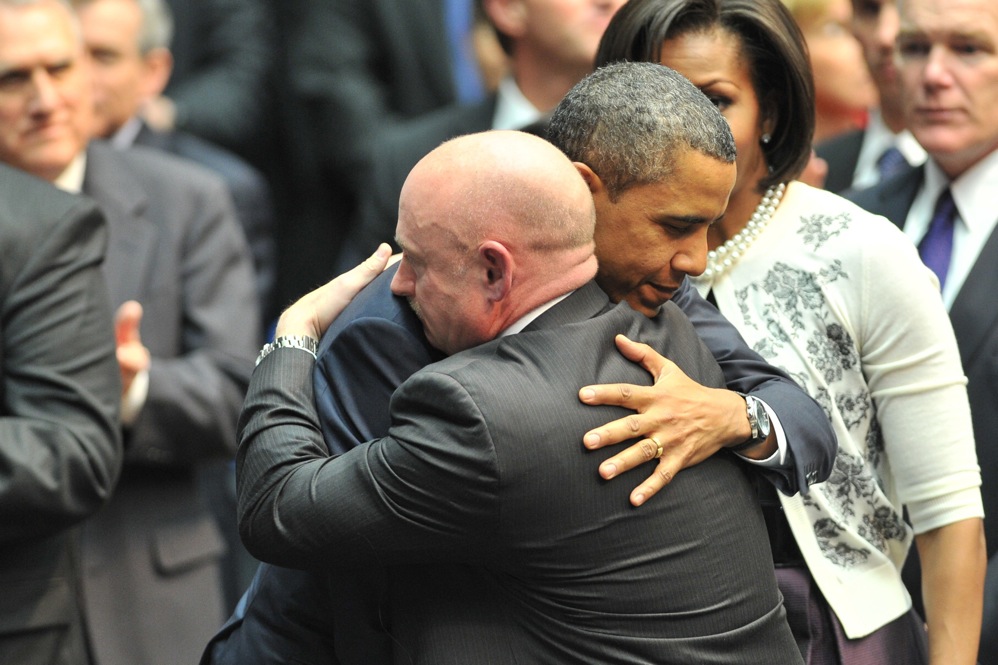 President Obama hugs Kelly during a memorial service, "Together We Thrive: Tucson and America," at the McKale Memorial Center in Tucson on Jan. 12. 