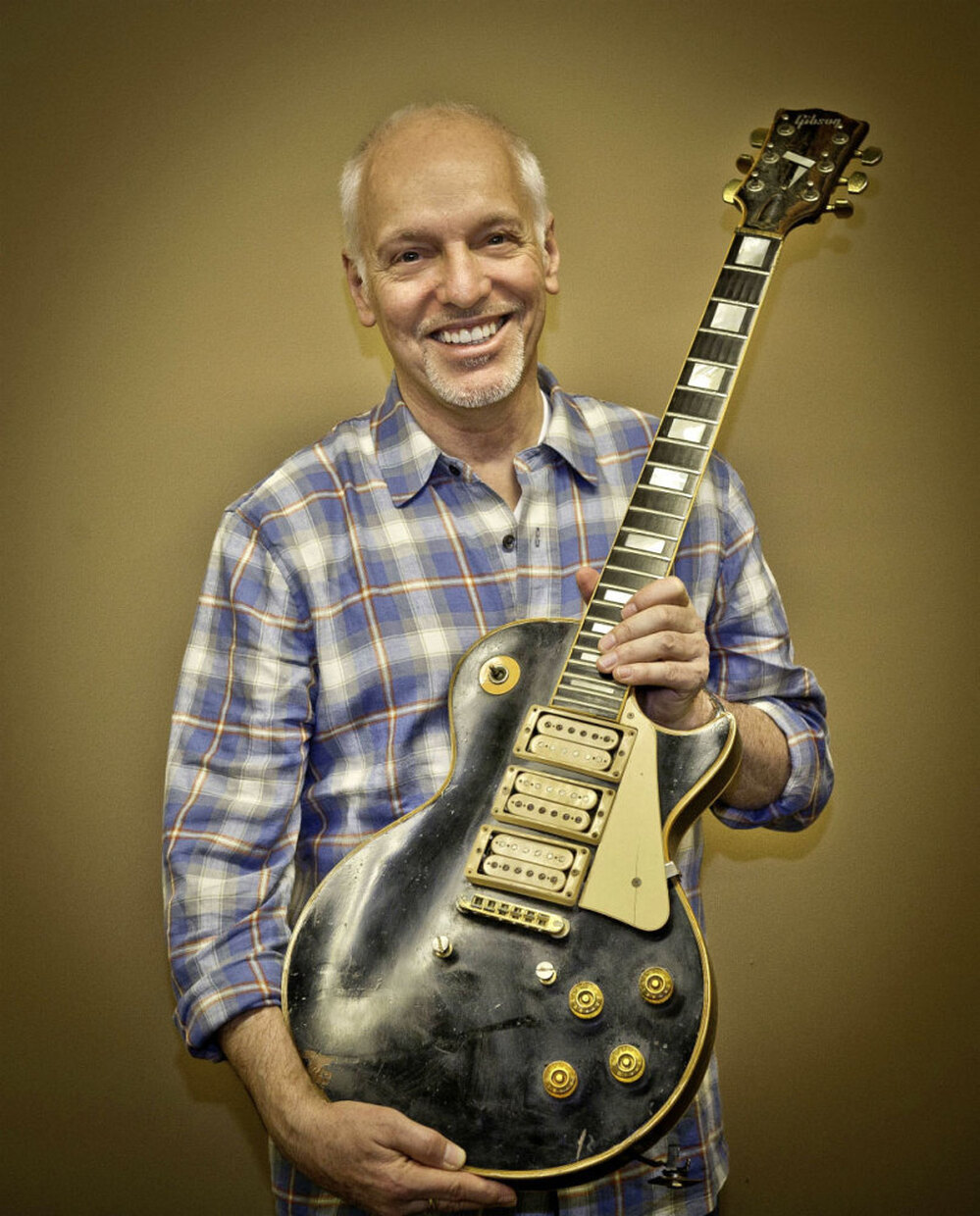 Frampton poses with the guitar he thought he'd lost forever.