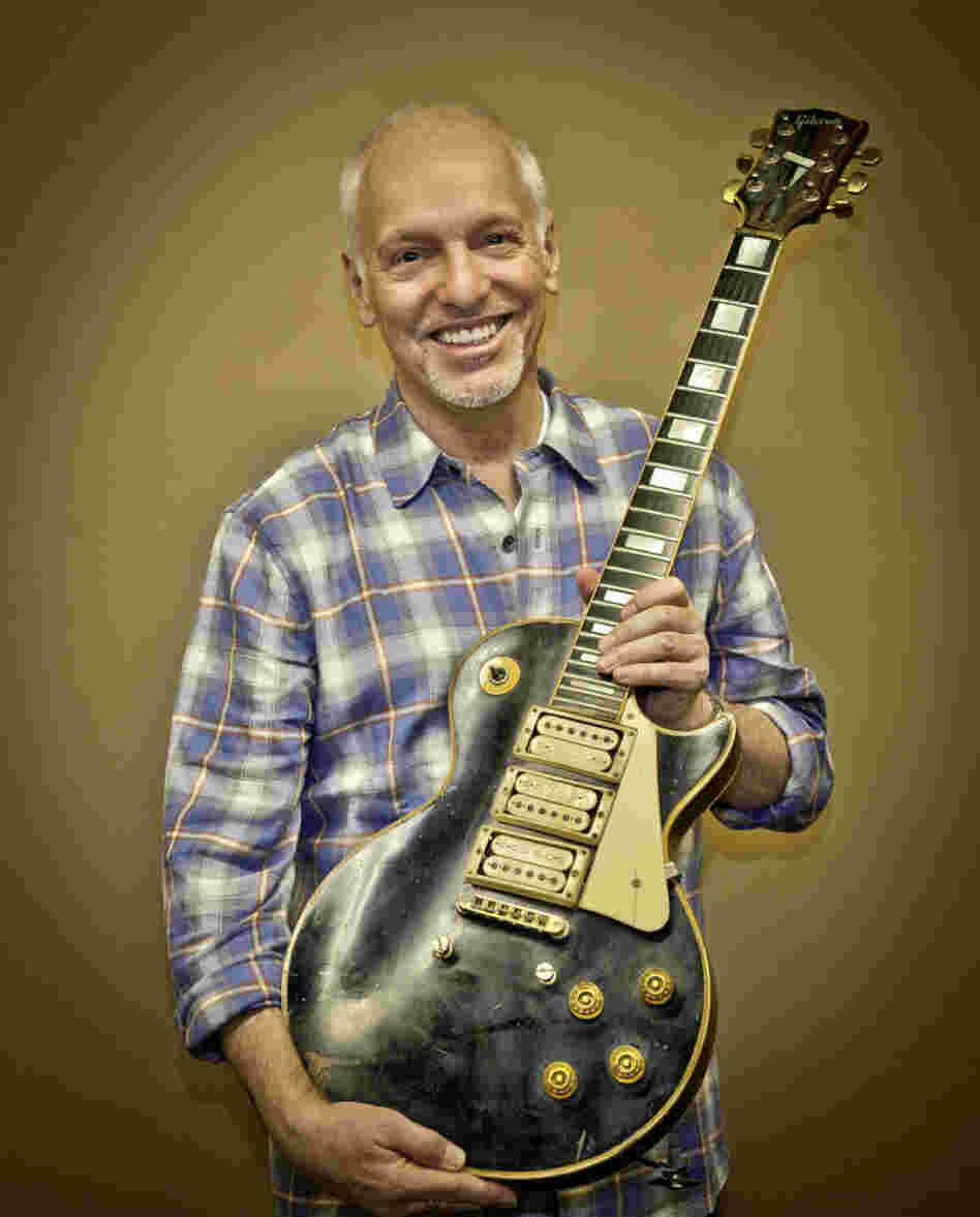 Frampton poses with the guitar he thought he'd lost forever.