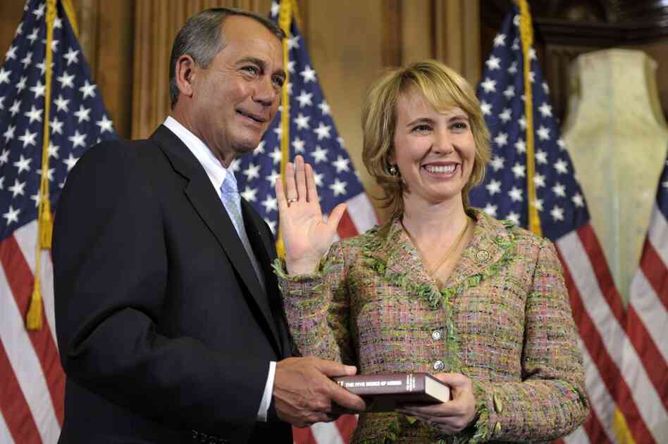 Giffords reenacts her swearing-in with House Speaker John Boehner. The Democrat has represented Arizona's 8th congressional district since 2007. 