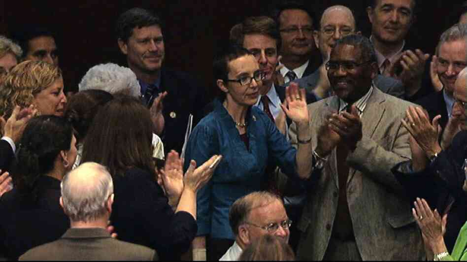 Giffords appears on the floor of the House of Representatives for the first time since she was shot to vote on a debt standoff compromise on Aug. 1. 