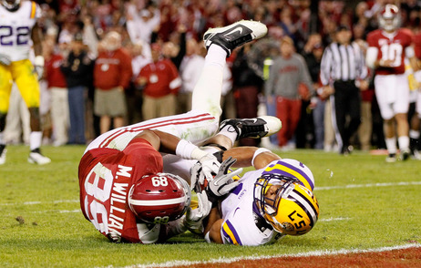 Not Giving An Inch: You can expect to see lots of close contact in Monday's BCS national title game. Here, Eric Reid of the LSU Tigers defends against Michael Williams of the Alabama Crimson Tide. Not Giving An Inch: You can expect to see lots of close contact in Monday's BCS national title game. Here, Eric Reid of the LSU Tigers defends against Michael Williams of the Alabama Crimson Tide.