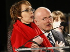 Rep. Gabrielle Giffords (D-Ariz.) and her husband, Mark Kelly, as they recited the Pledge of Allegiance at Sunday's memorial service in Tucson. Rep. Gabrielle Giffords (D-Ariz.) and her husband, Mark Kelly, as they recited the Pledge of Allegiance at Sunday's memorial service in Tucson.