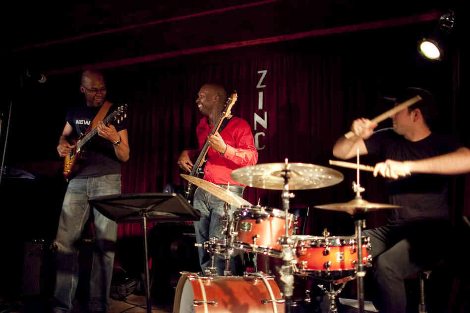 Inside Zinc Bar, guitarist Lionel Loueke (left) played material from his upcoming album, with a new band of Michael Olatuja (bass) and Mark Guiliana (drums).