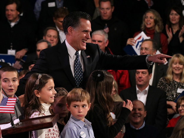 Mitt Romney greets supporters in Manchester, N.H., after his primary night win.