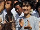 Myanmar democracy icon Aung San Suu Kyi, center, at an campaign event on Tuesday. Myanmar democracy icon Aung San Suu Kyi, center, at an campaign event on Tuesday.