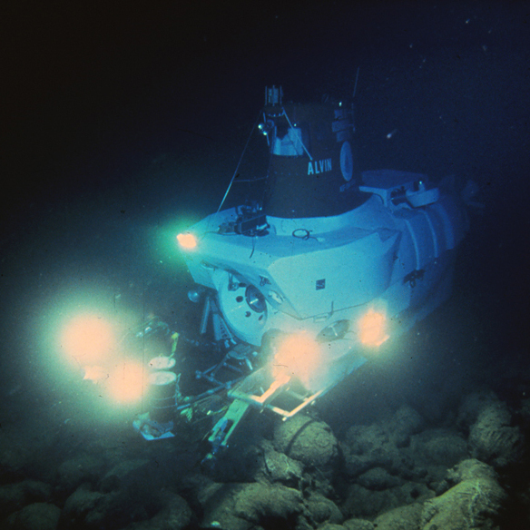 Beneath 8,200 feet of water, the Alvin submarine scopes out the Pacific's seafloor in the 1970s. The geologists aboard weren't searching for life — they were on the hunt for hot spots and undersea thermal vents.
