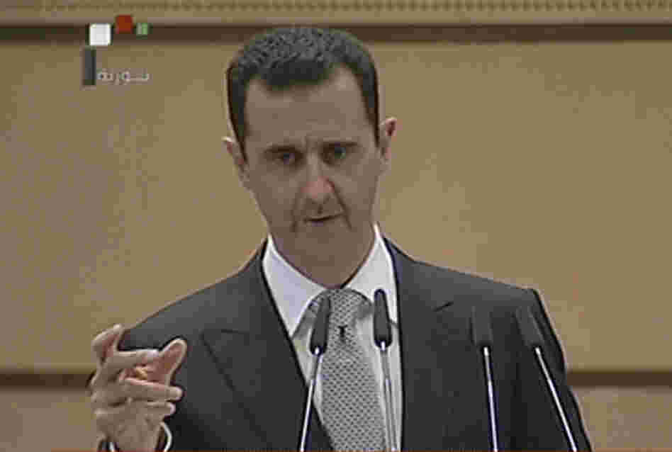 An image from Syrian state television shows Syrian President Bashar Assad delivering his speech Tuesday in Damascus.
