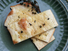 Slices of coca, or flatbread, on a plate Slices of coca, or flatbread, on a plate
